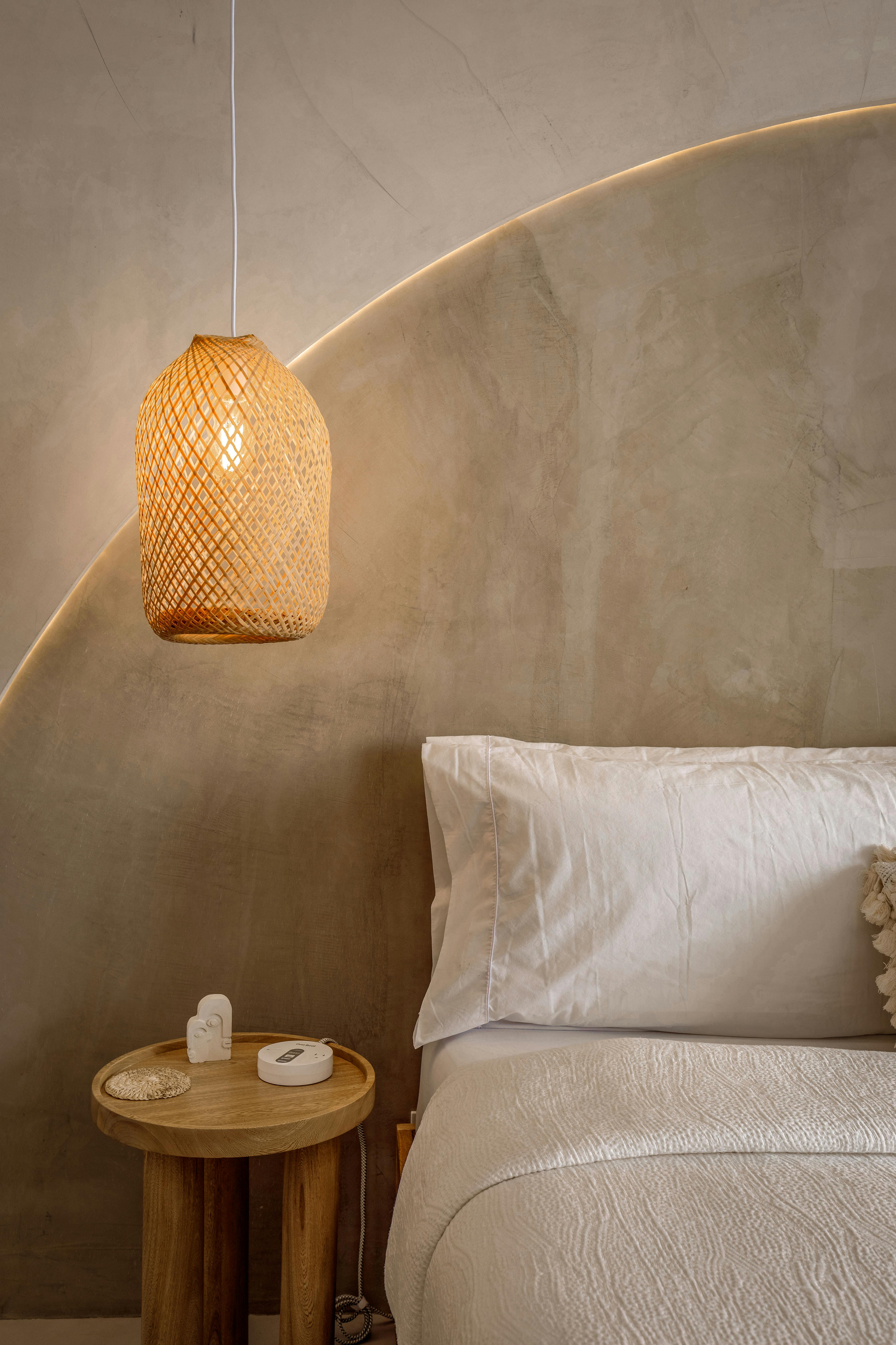 Stays in Puerto Rico 45 Cozy bedroom with woven pendant lamp at Otium rental
